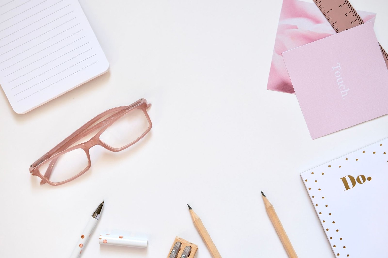 Minimal desk with neatly arranged stationery and clear zones for calm organization.