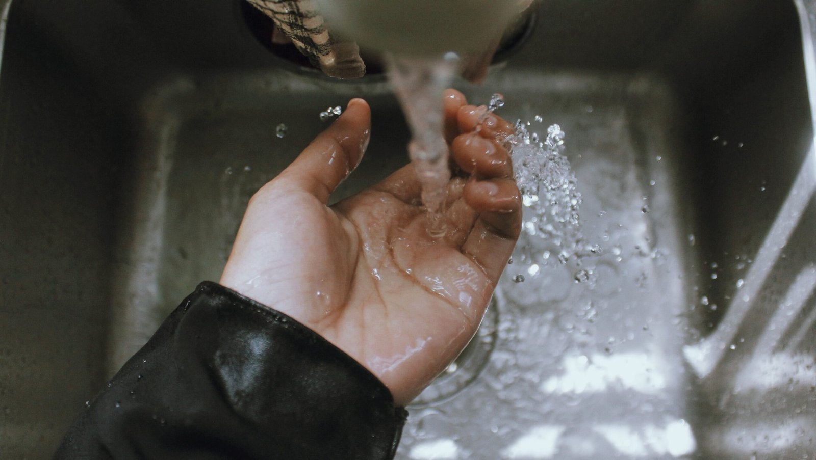 Sink-side cleanup step that helps a fridge declutter checklist by food safety priority work after dinner.