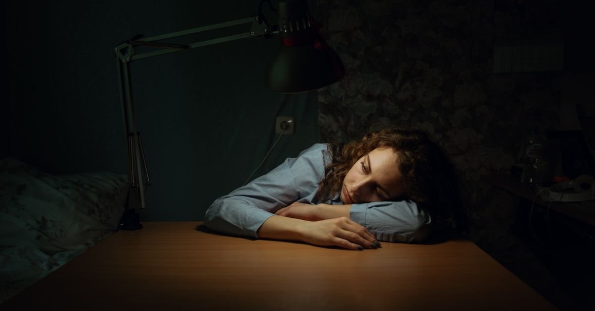 Someone looking tired at a desk