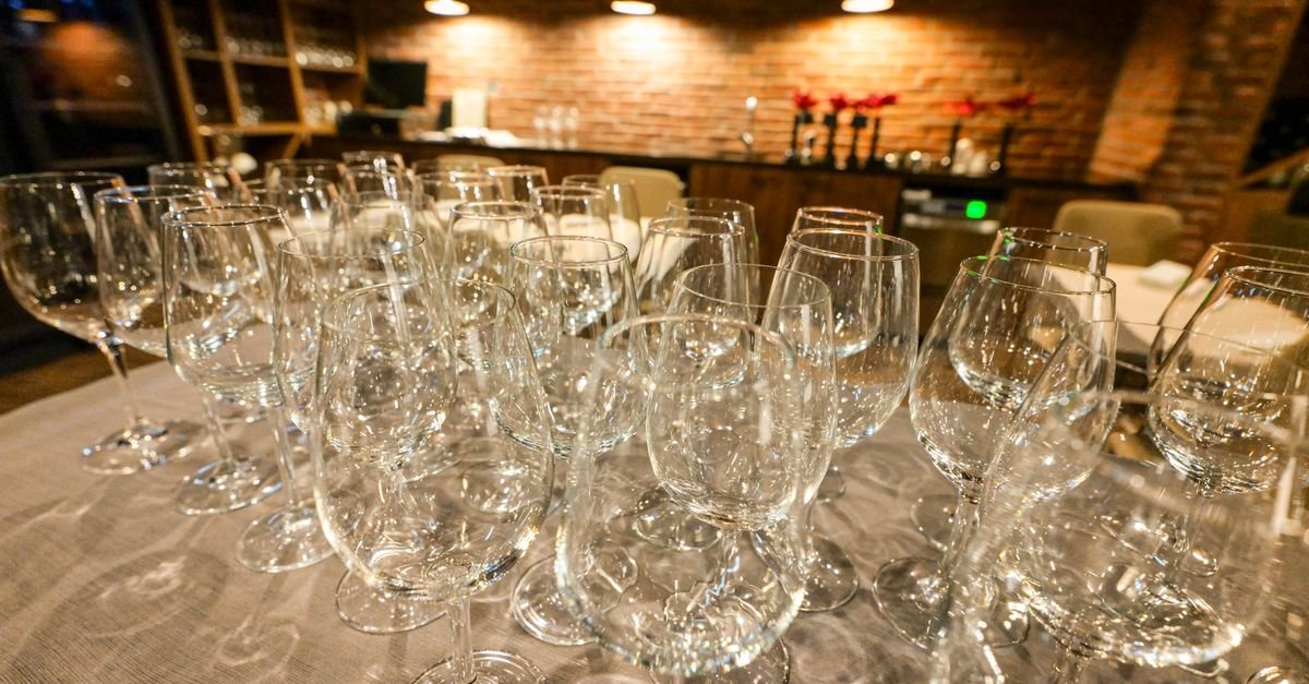 Wine glasses on a table in the evening