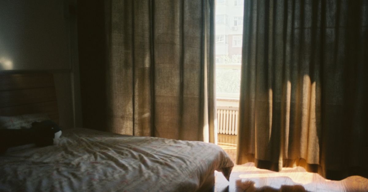 Morning light falling across a bed