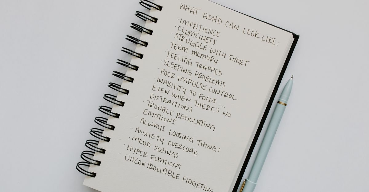 A notebook and pen used to record symptoms